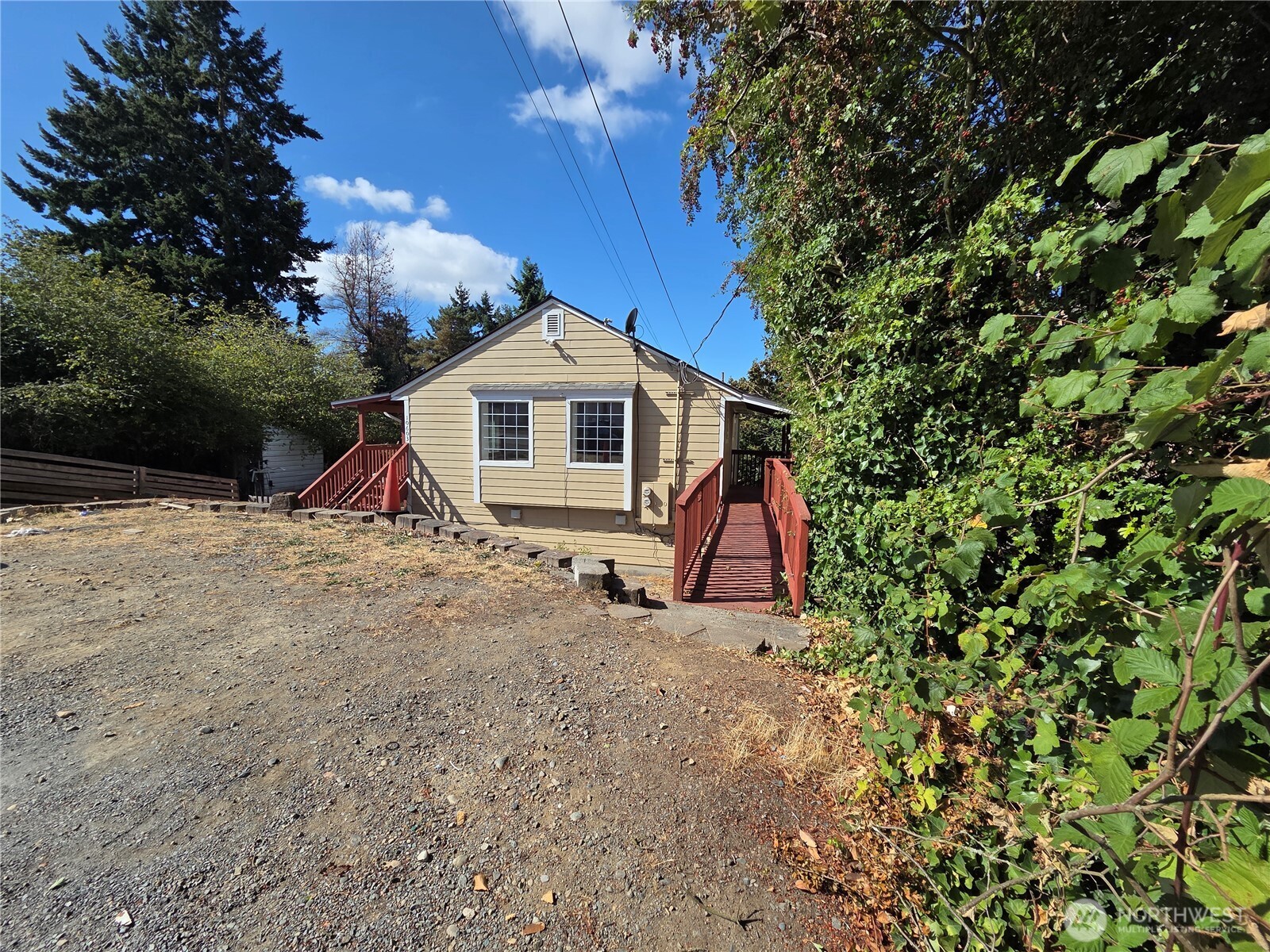 10603 12th Avenue Southwest Seattle, WA 98146 - Photo 3 of 14 a view of a house with a yard and sitting area