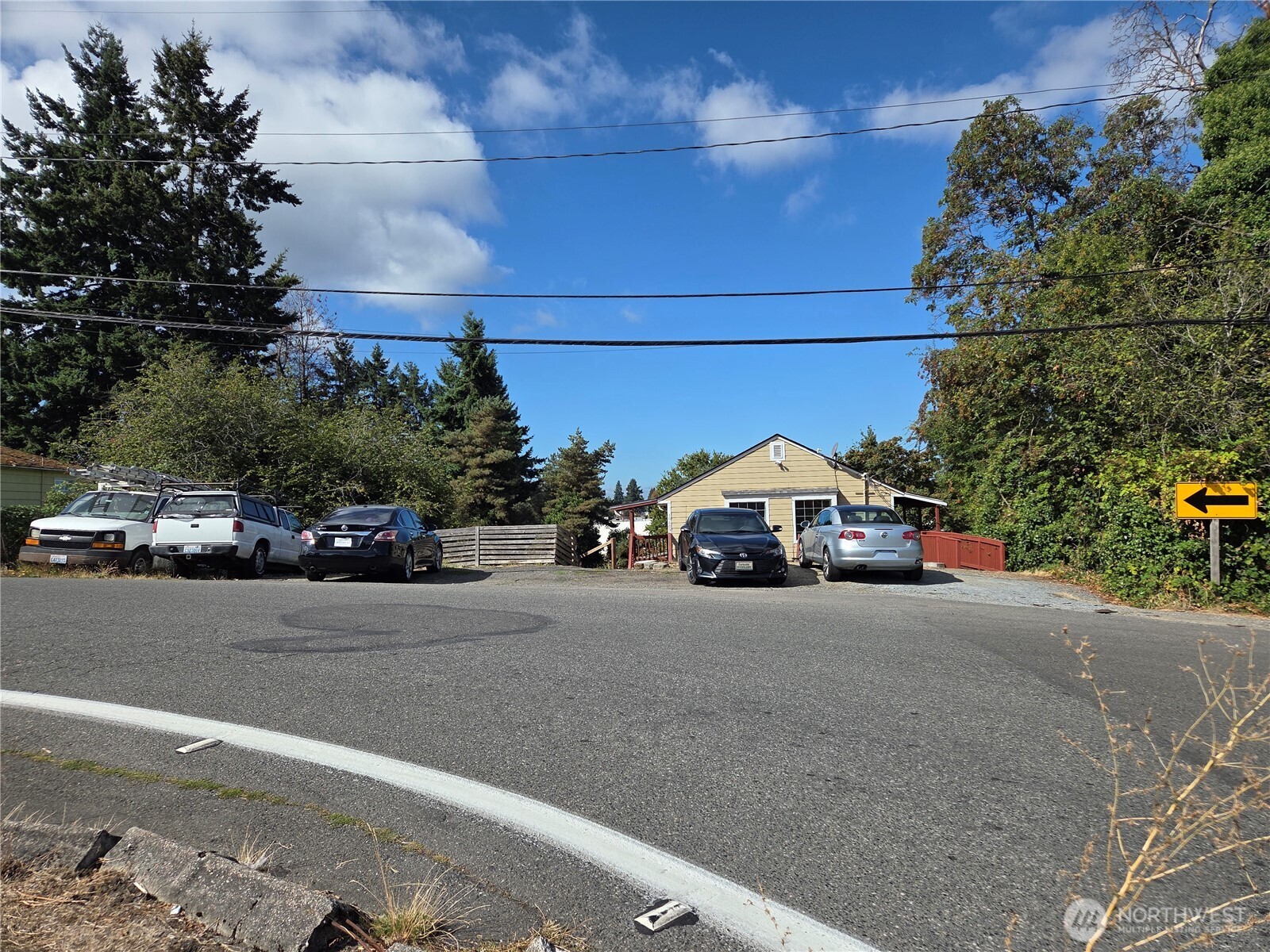10603 12th Avenue Southwest Seattle, WA 98146 - Photo 5 of 14 a car parked on the side of a street