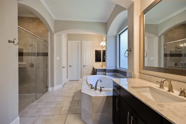 a bathroom with a granite countertop sink mirror and double