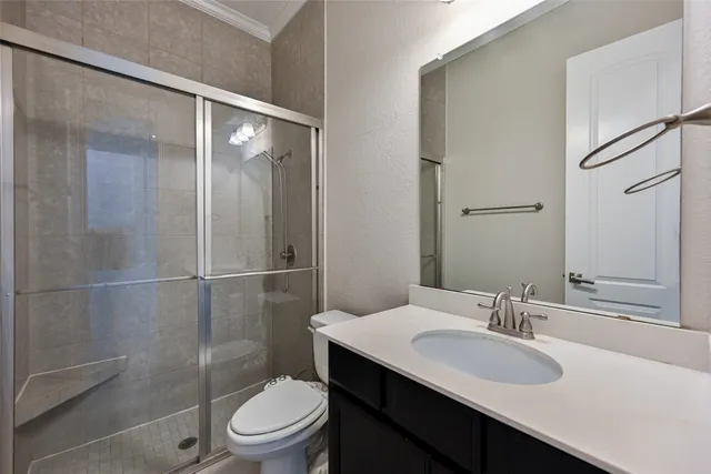 a bathroom with a sink toilet and a mirror