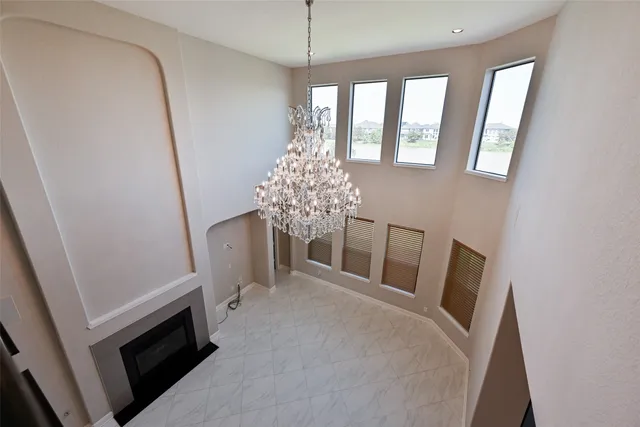 a view of a room with window and hardwood floor