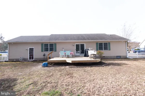 a front view of a house with a yard and porch