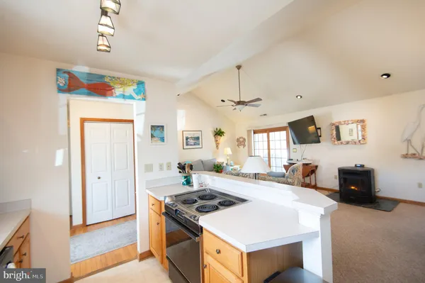 a kitchen with a stove and a refrigerator
