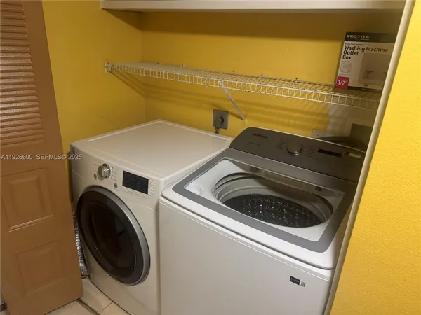 a utility room with dryer and washer