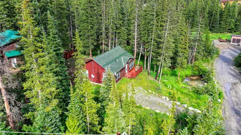 a view of a lake with a house in the background