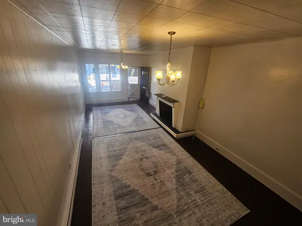 an entryway with an empty room