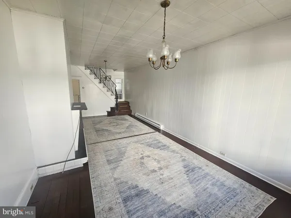 a view of a hallway with a chandelier
