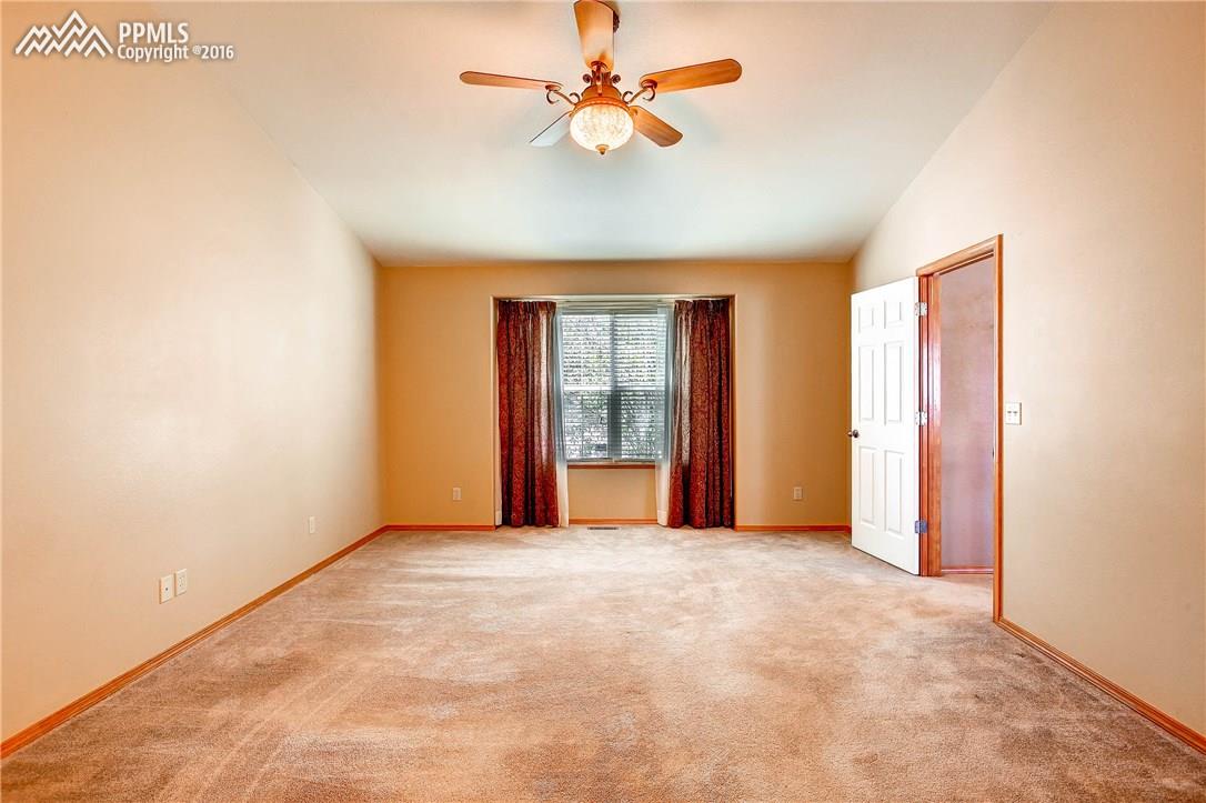 12330 Motley Road Peyton, CO 80831 - Photo 10 of 27 Spacious Master Bedroom has warm, neutral colors