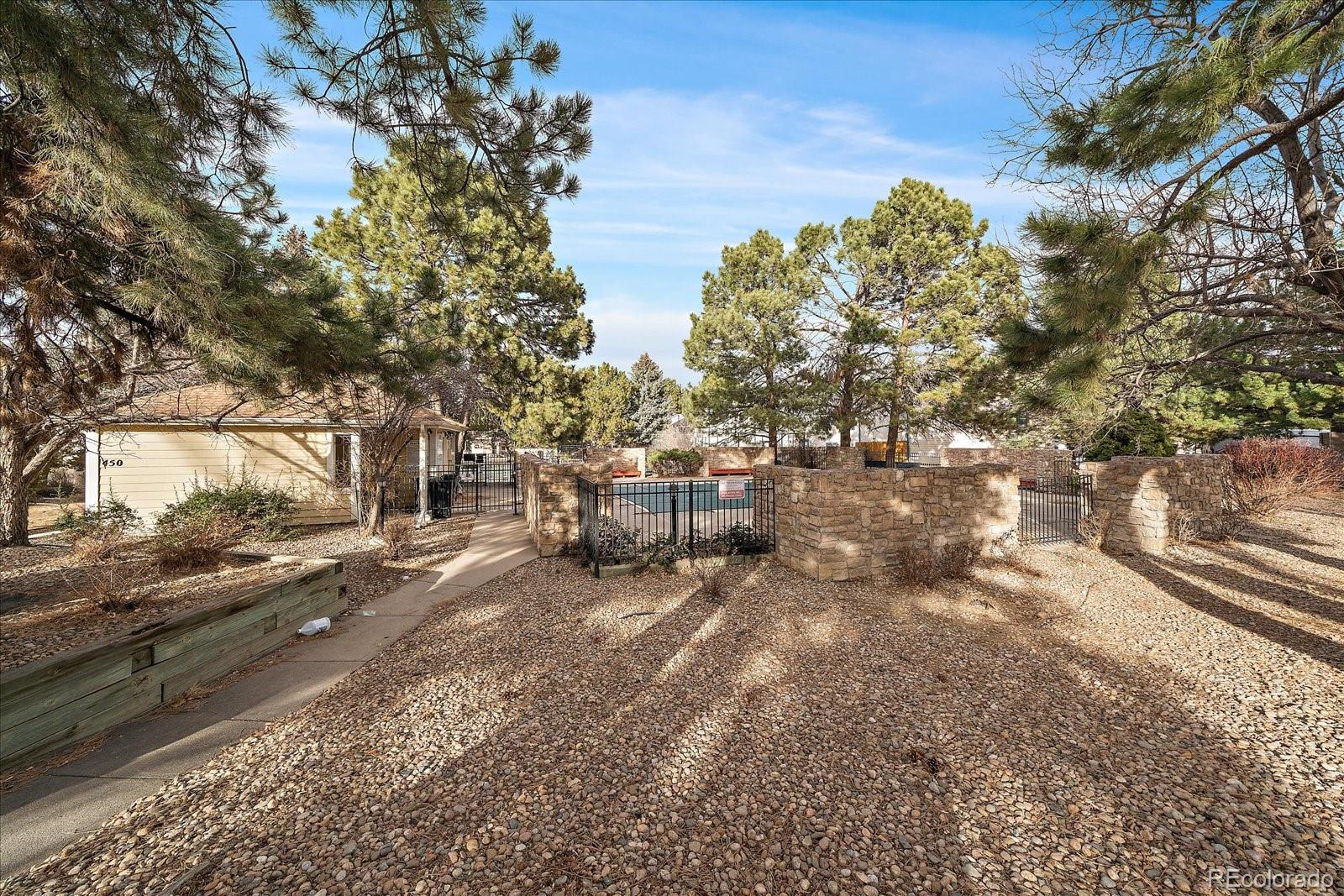 471 South Kalispell Way, Unit 101 Aurora, CO 80017 - Photo 26 of 27 a view of a yard with car parked