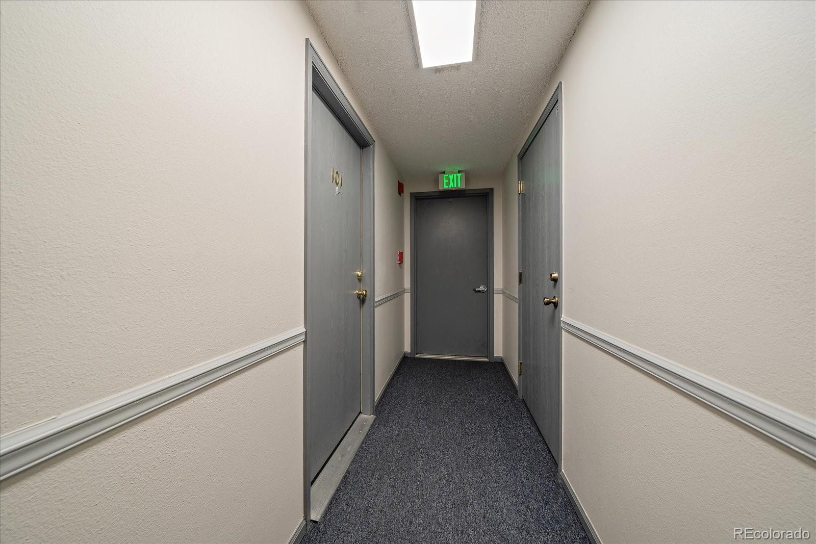 471 South Kalispell Way, Unit 101 Aurora, CO 80017 - Photo 3 of 27 a view of hallway with an empty room