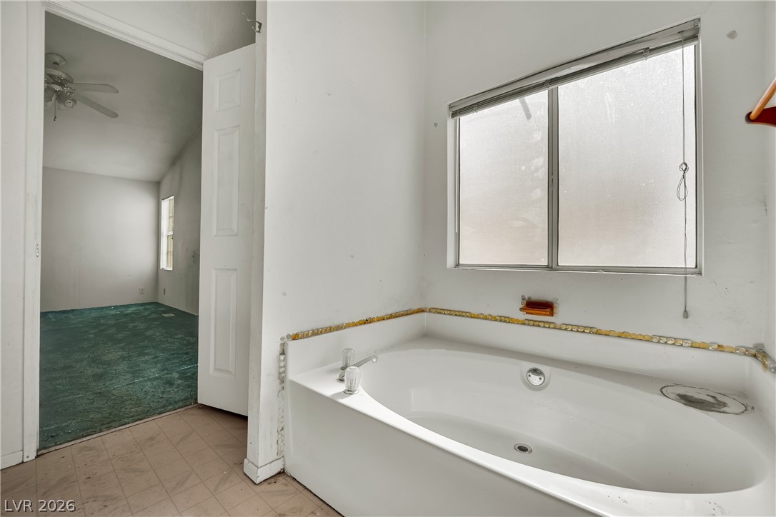 4361 Maple Road Pahrump, NV 89048 - Photo 22 of 46 A spacious tub awaits, offering a tranquil retreat within this well-appointed bathroom space.