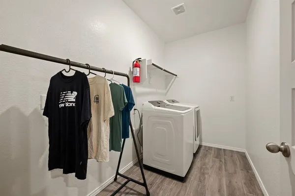 a utility room with dryer and washer