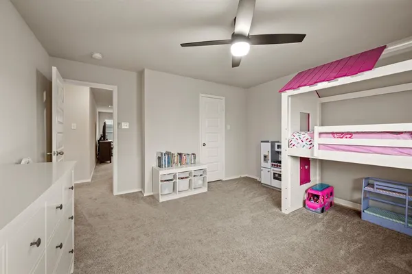 a bedroom with furniture and a chandelier