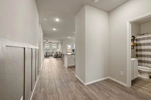 a view of a kitchen from the hallway