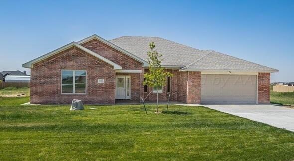 9289 Clinton Glen Road Amarillo, TX 79119 - Photo 1 of 27 a front view of a house with a yard and garage