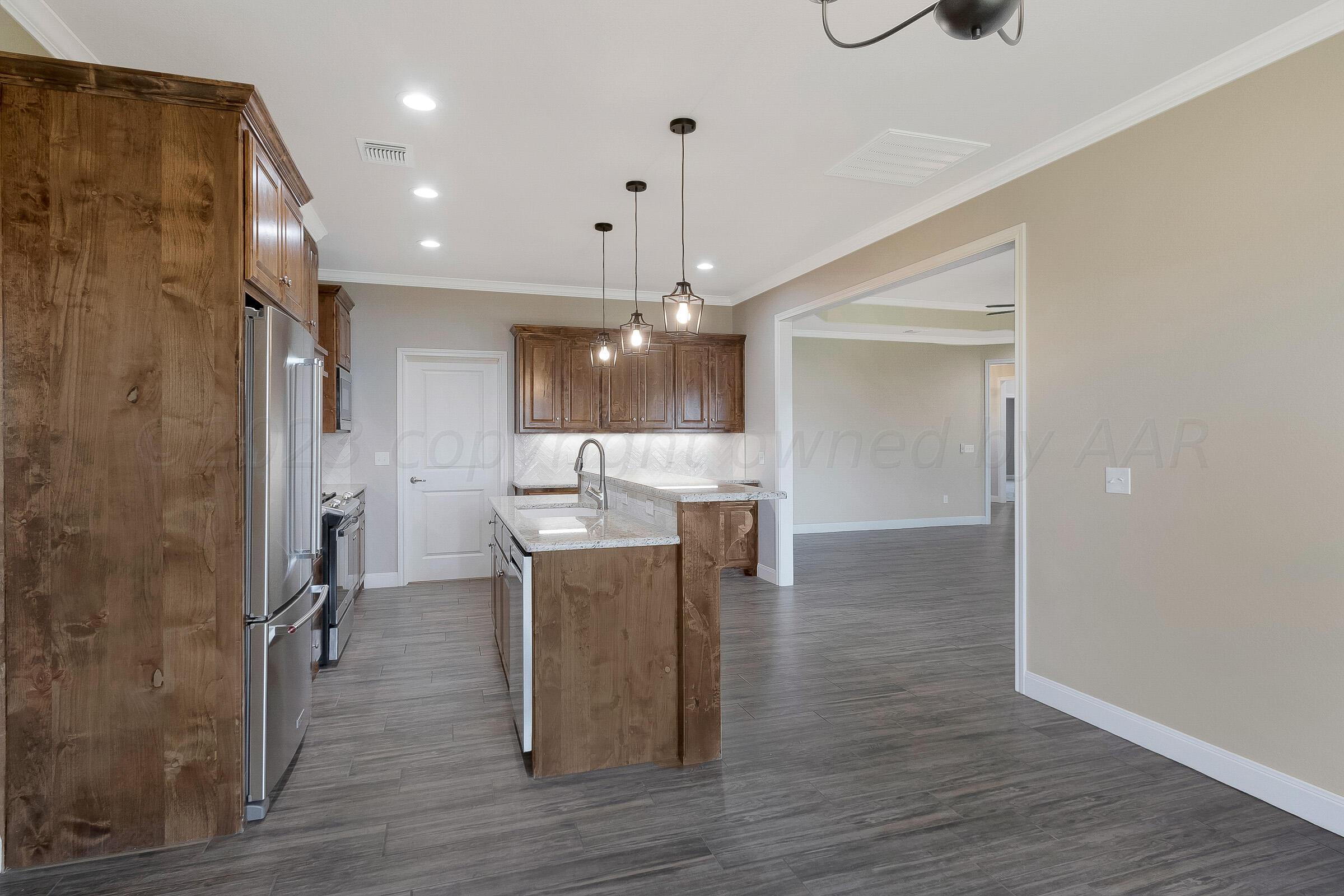 9289 Clinton Glen Road Amarillo, TX 79119 - Photo 11 of 27 a view of a kitchen and a window