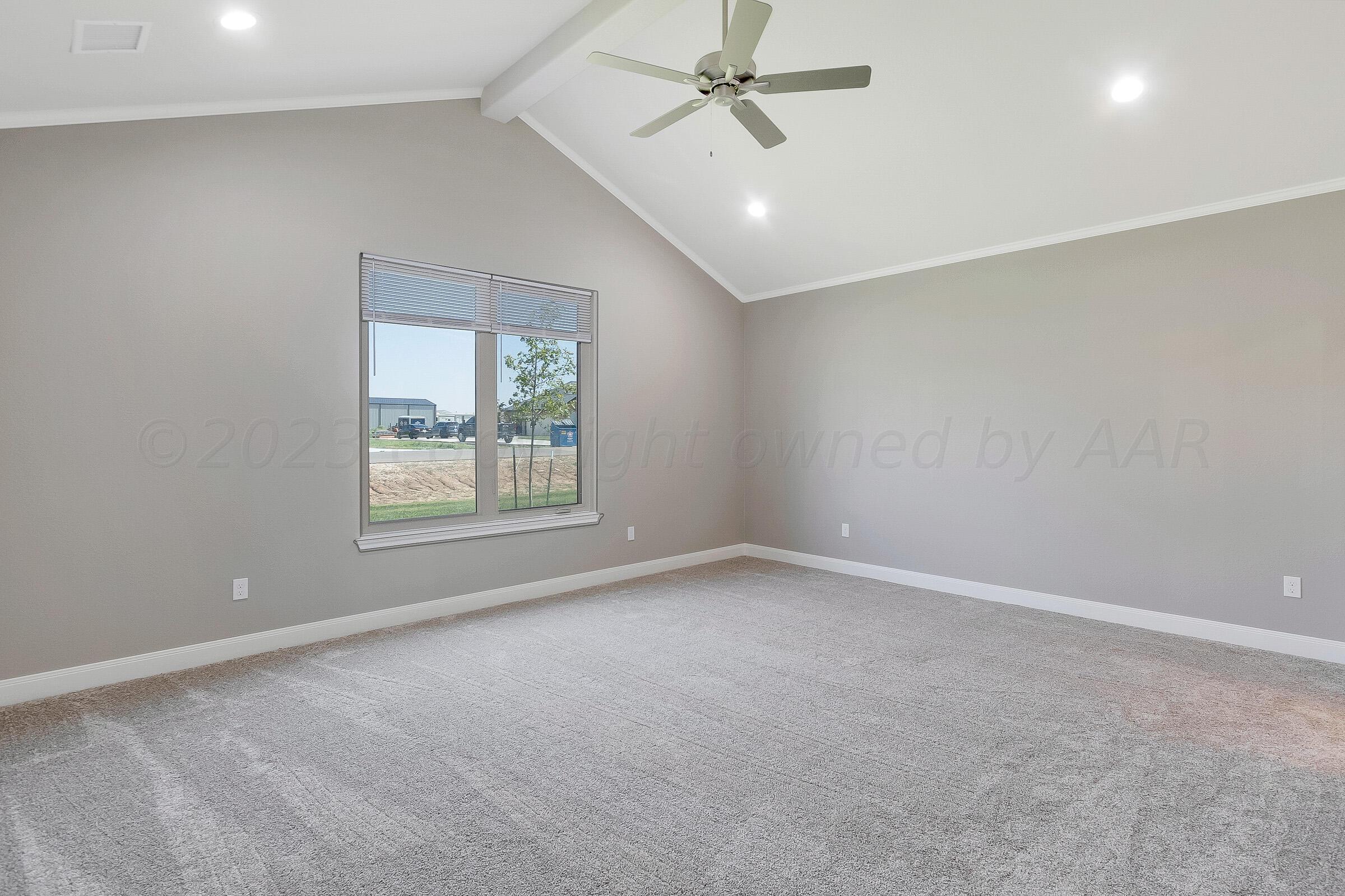 9289 Clinton Glen Road Amarillo, TX 79119 - Photo 13 of 27 an empty room with a window and a fan