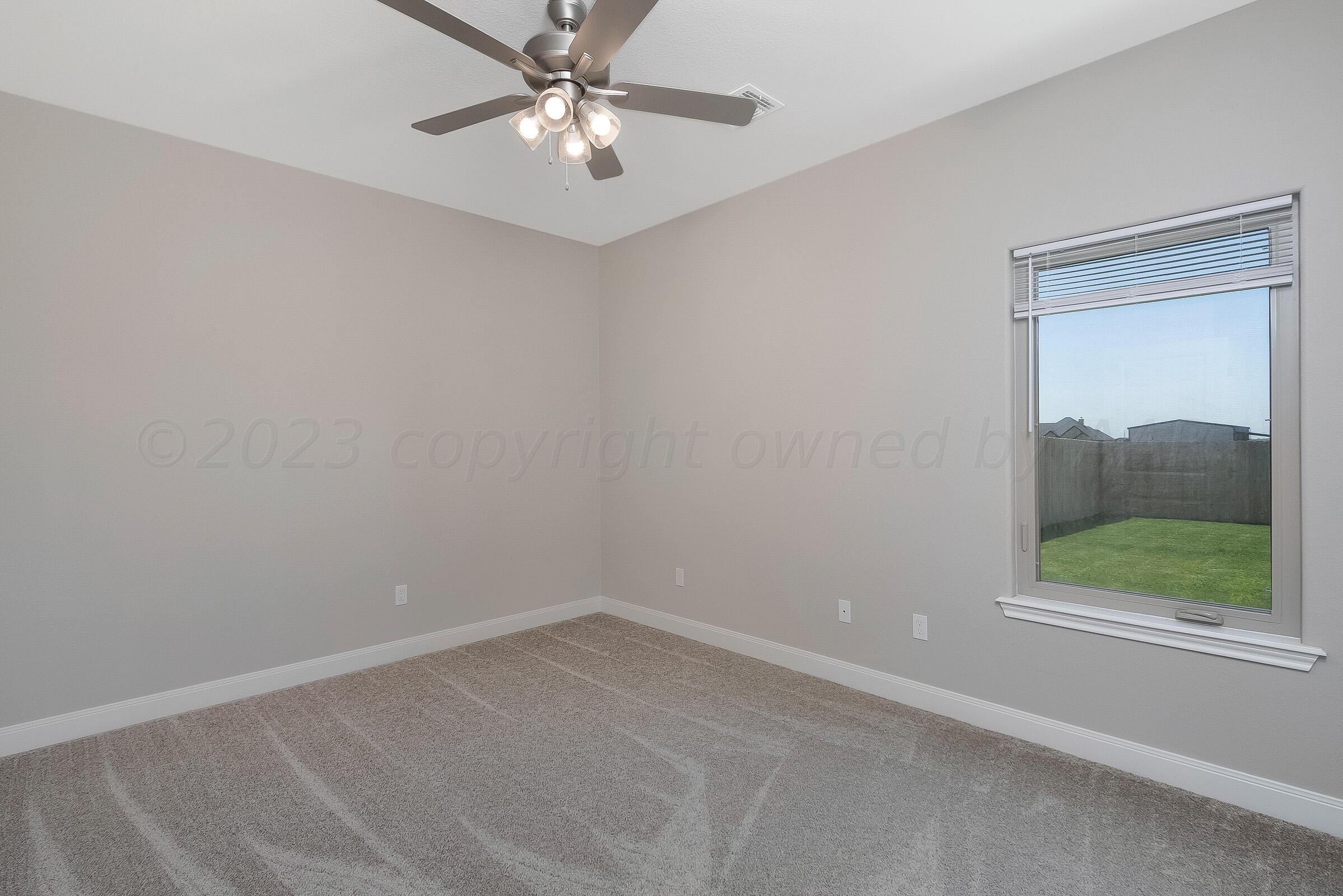 9289 Clinton Glen Road Amarillo, TX 79119 - Photo 20 of 27 an empty room with a window