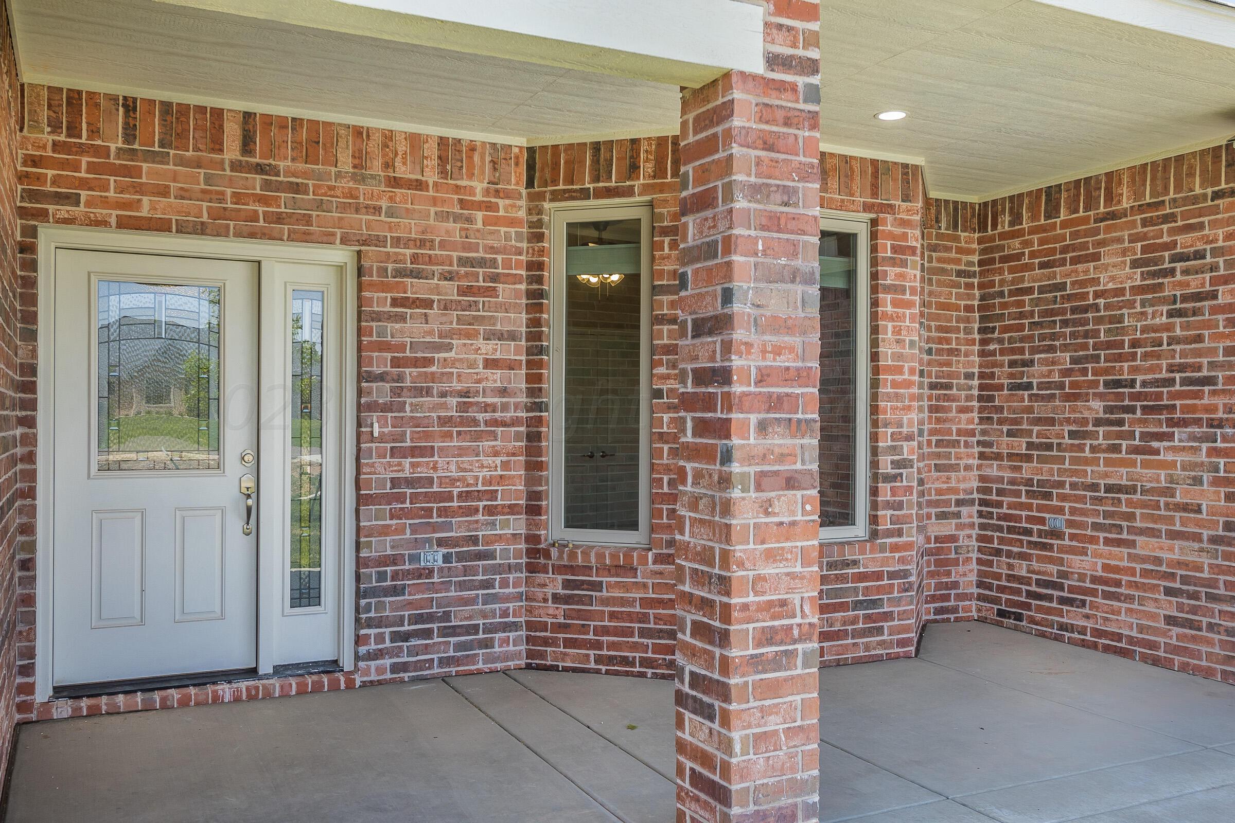 9289 Clinton Glen Road Amarillo, TX 79119 - Photo 2 of 27 a front view of a building with a shower