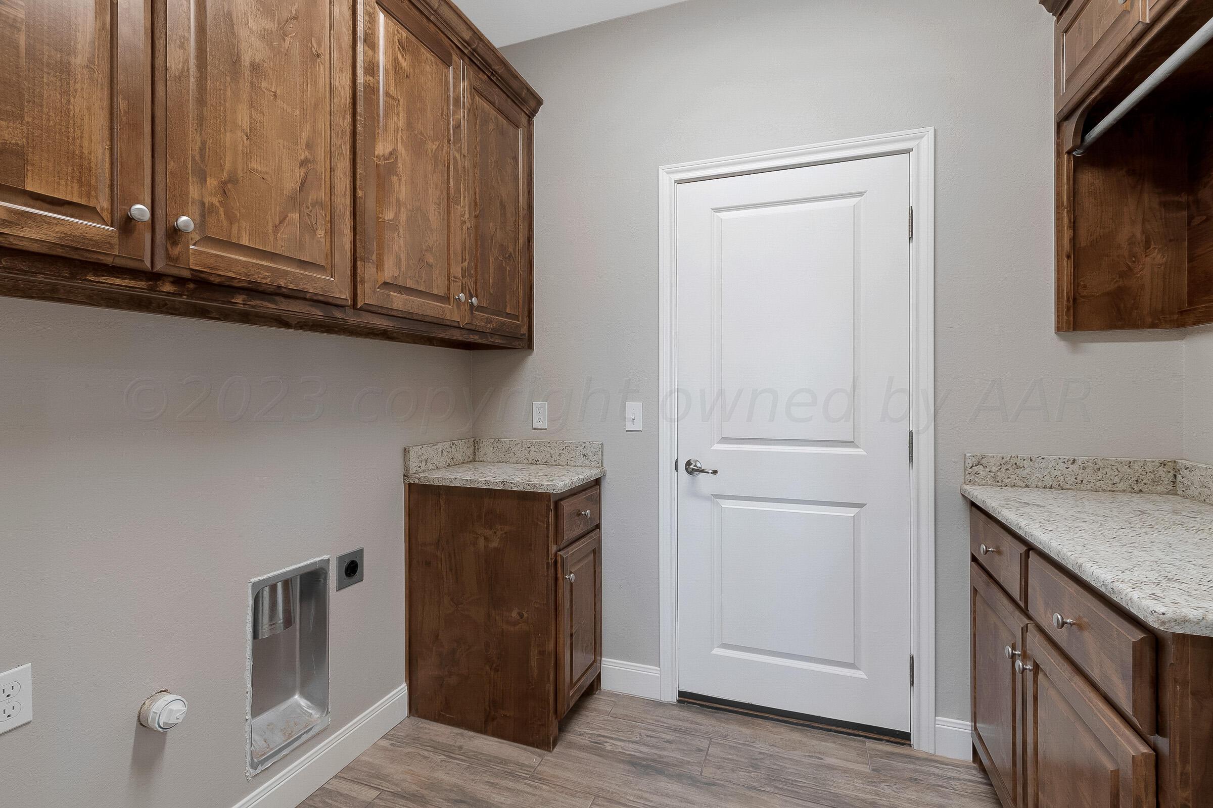9289 Clinton Glen Road Amarillo, TX 79119 - Photo 22 of 27 a view of cabinets with wooden floor and cabinet