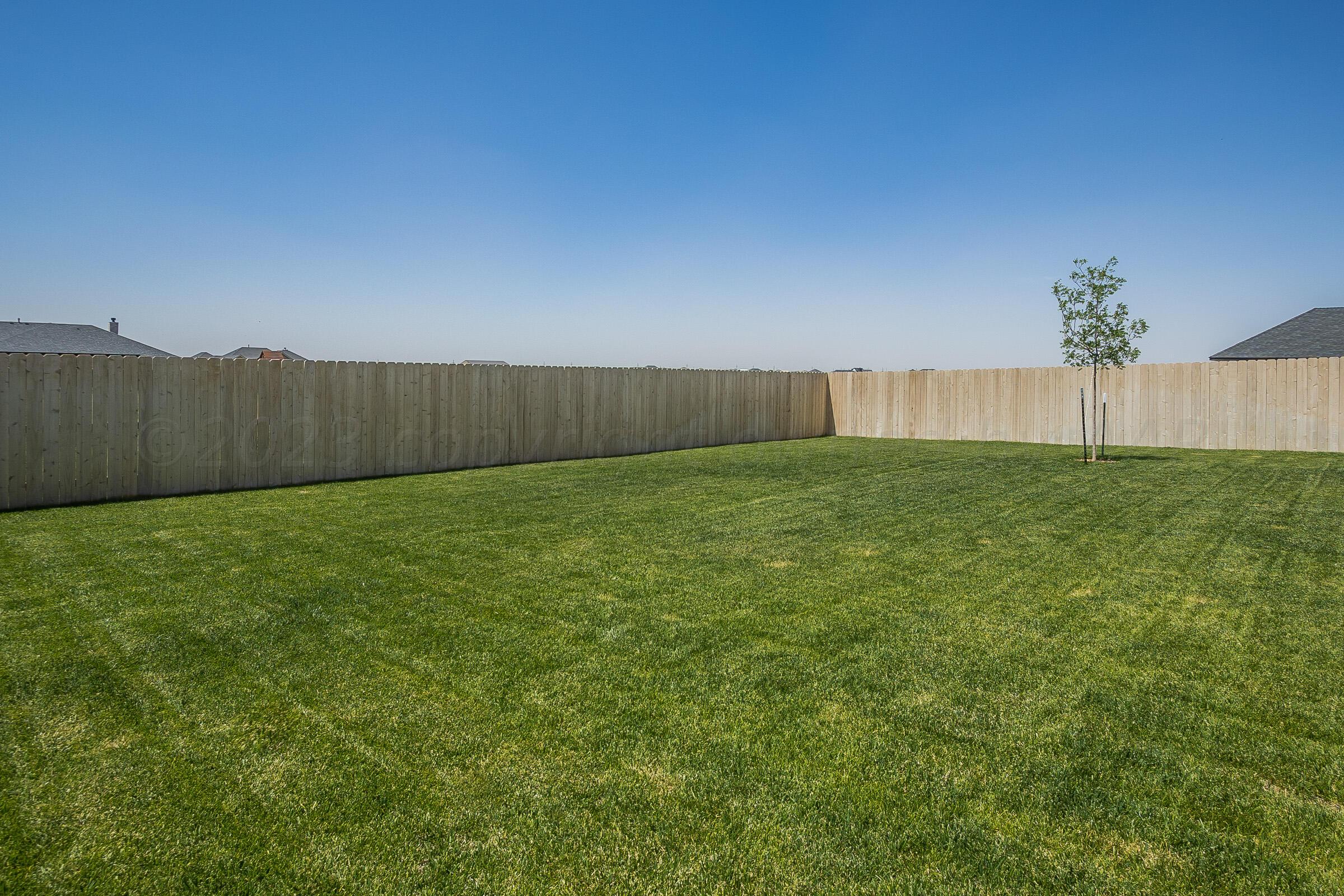9289 Clinton Glen Road Amarillo, TX 79119 - Photo 24 of 27 a view of yard with swimming pool and wooden fence