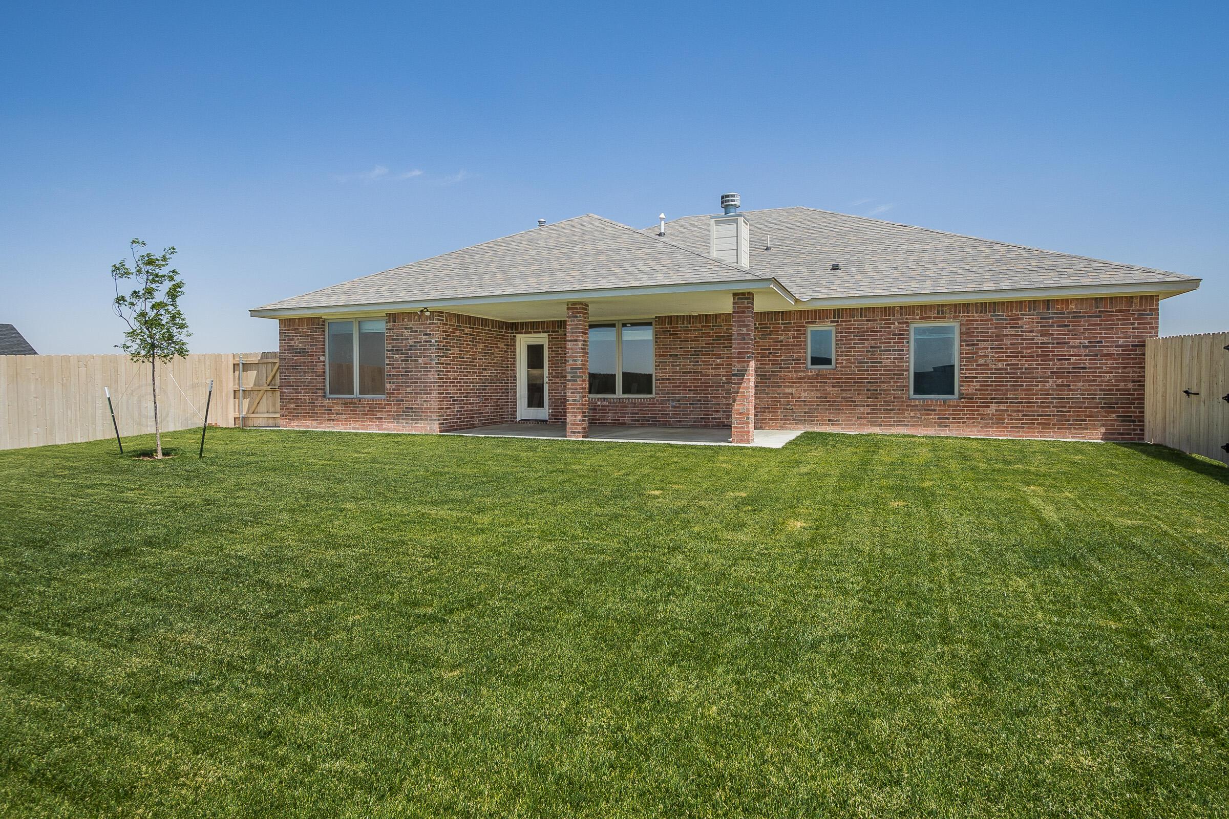 9289 Clinton Glen Road Amarillo, TX 79119 - Photo 25 of 27 a front view of a house with a yard