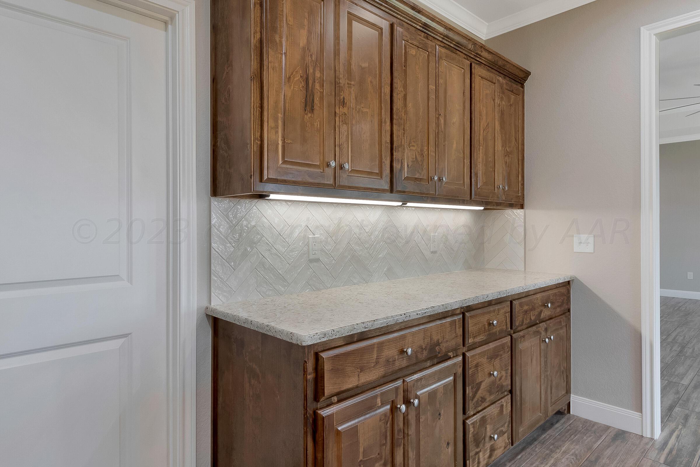 9289 Clinton Glen Road Amarillo, TX 79119 - Photo 10 of 27 a room with a sink and cabinets