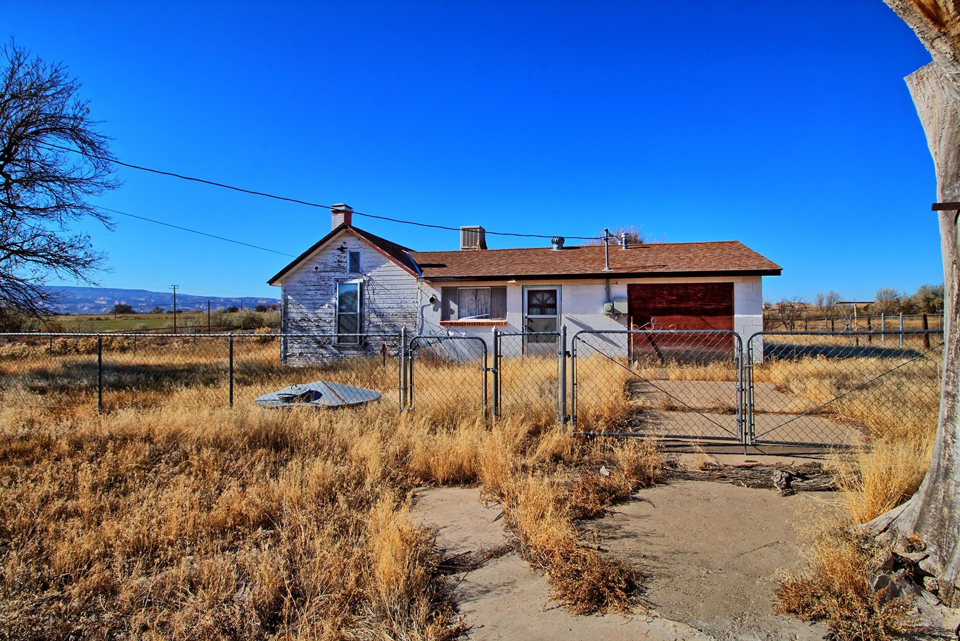 1688 M Road Fruita, CO 81521 - Photo 2 of 33 a view of a house with a yard