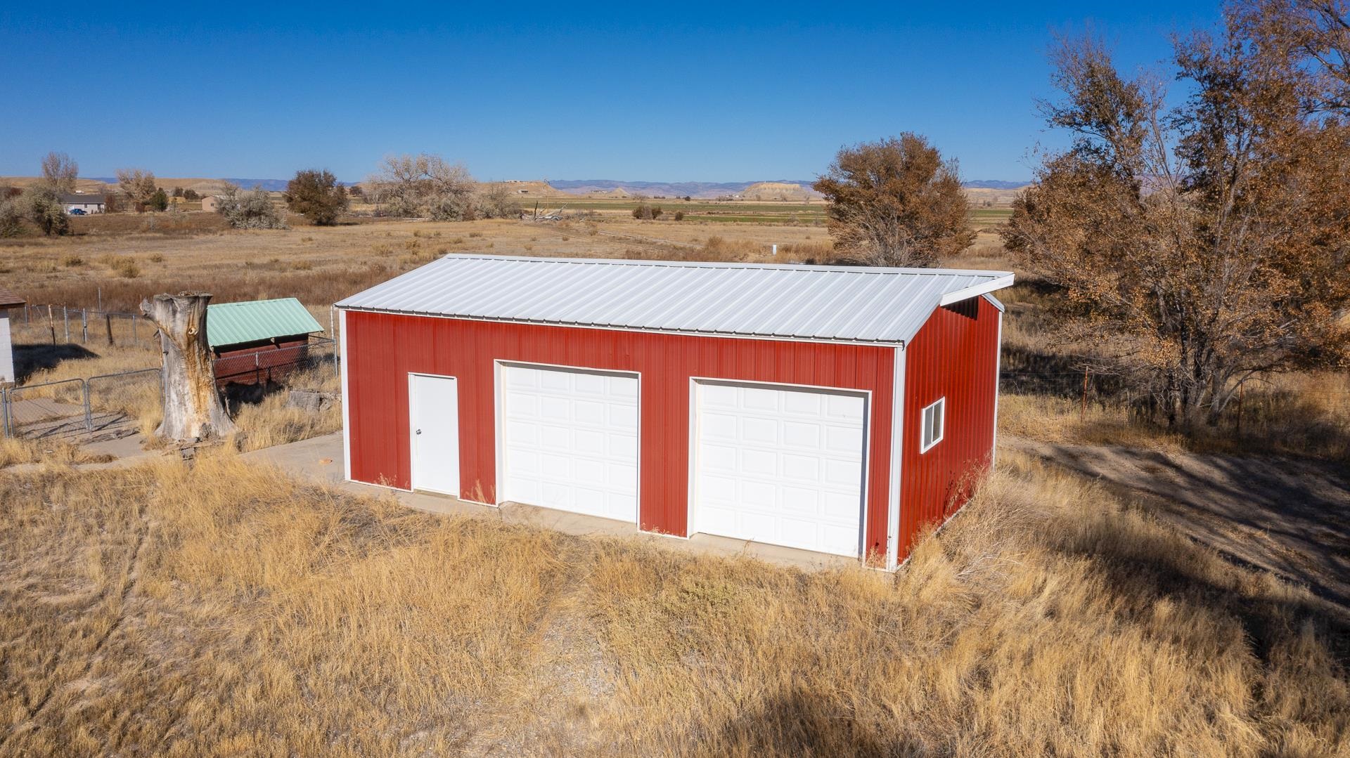 1688 M Road Fruita, CO 81521 - Photo 28 of 33 a view of a house with a yard
