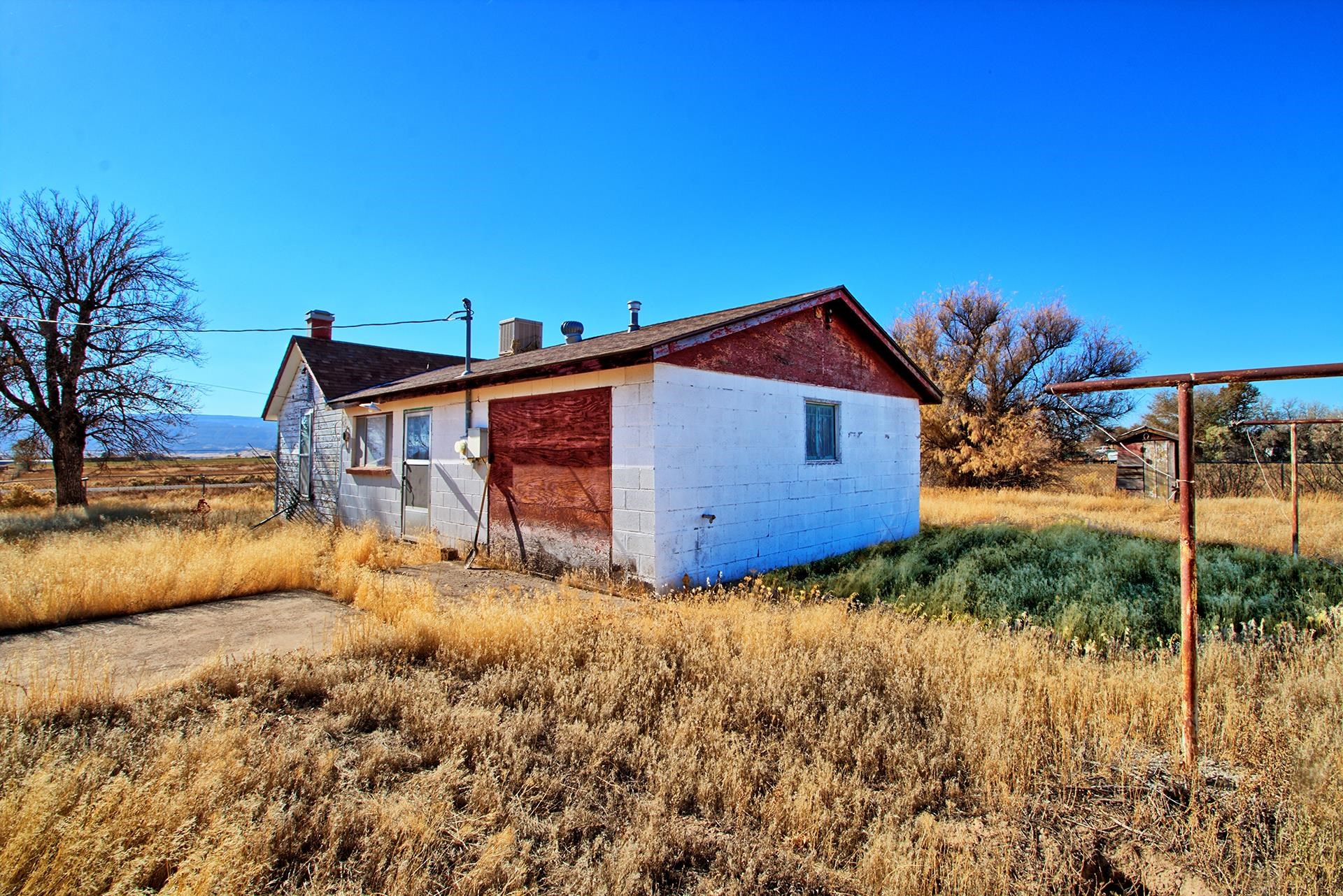 1688 M Road Fruita, CO 81521 - Photo 3 of 33 a view of a house with a yard