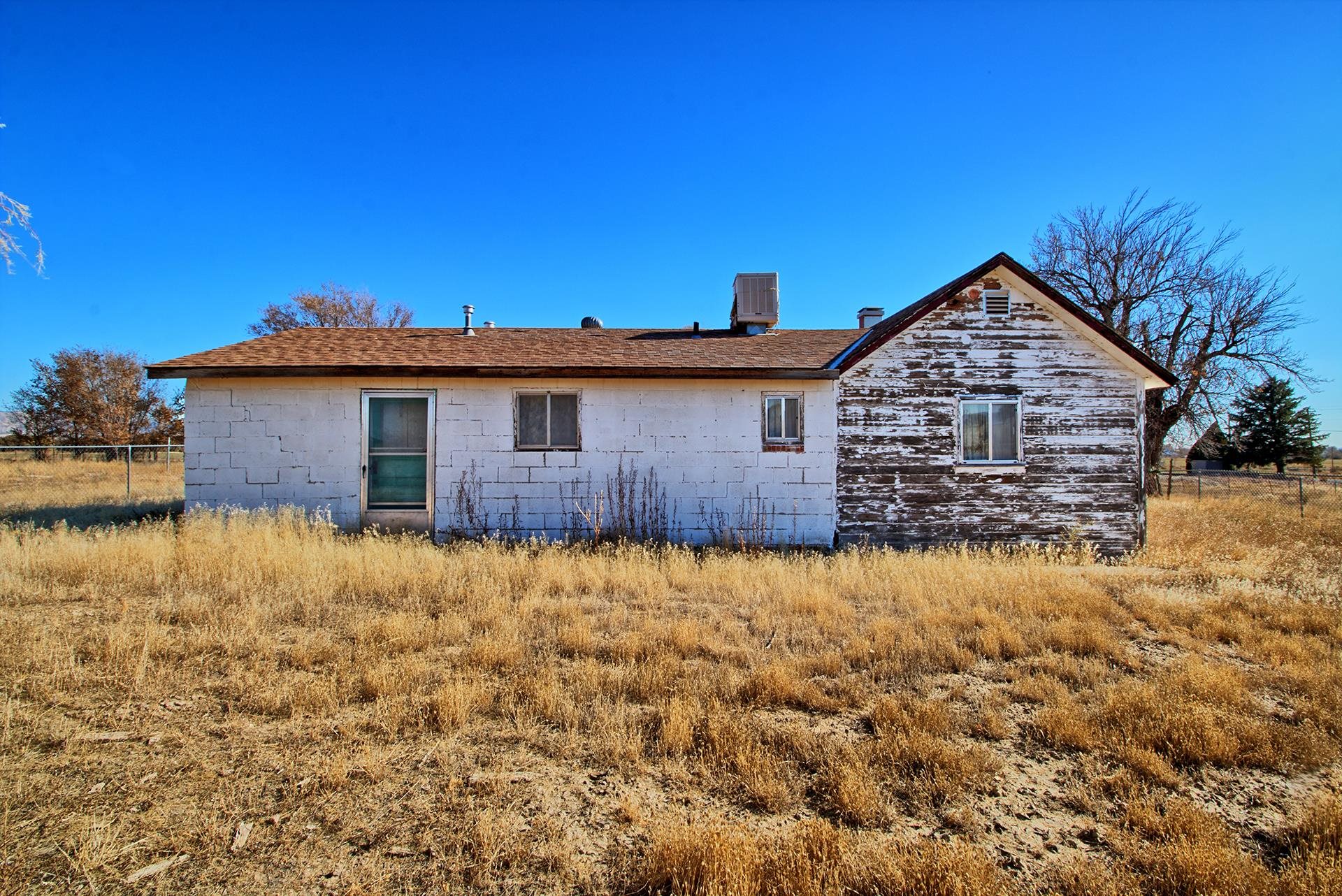 1688 M Road Fruita, CO 81521 - Photo 4 of 33 a backyard of a house with large trees