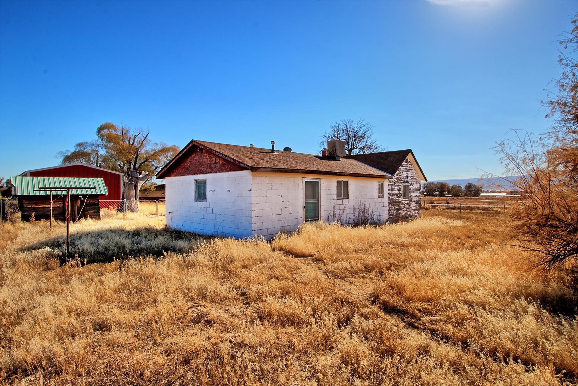 1688 M Road Fruita, CO 81521 - Photo 5 of 33 a front view of a house with a yard