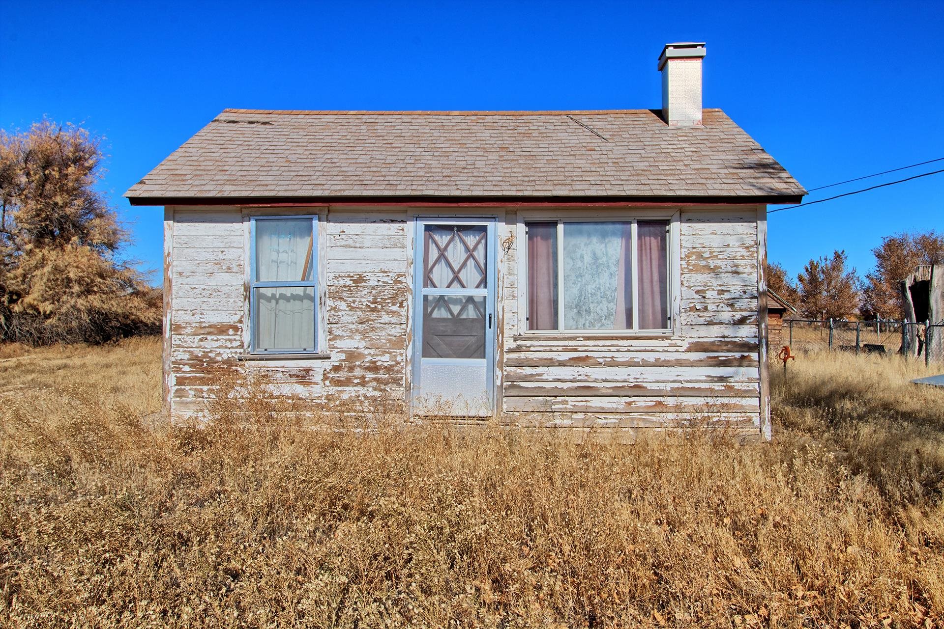 1688 M Road Fruita, CO 81521 - Photo 7 of 33 a front view of a house with garden