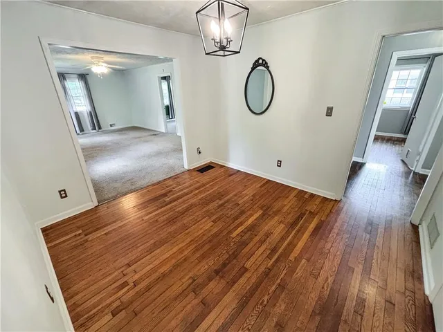 a view of a livingroom with wooden floor