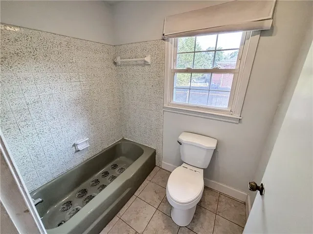 a bathroom with a toilet and a sink