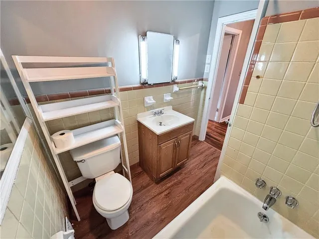 a bathroom with a sink toilet and shower