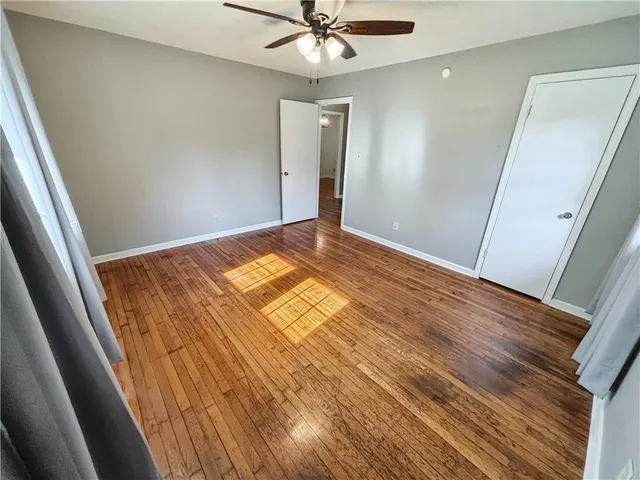 a view of an empty room and wooden floor