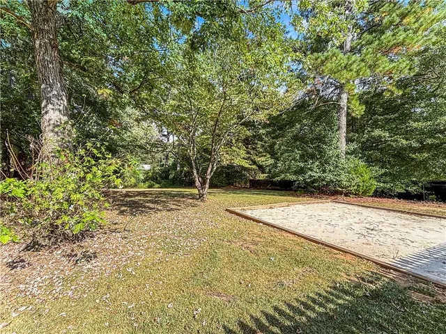 a view of a yard with a trees