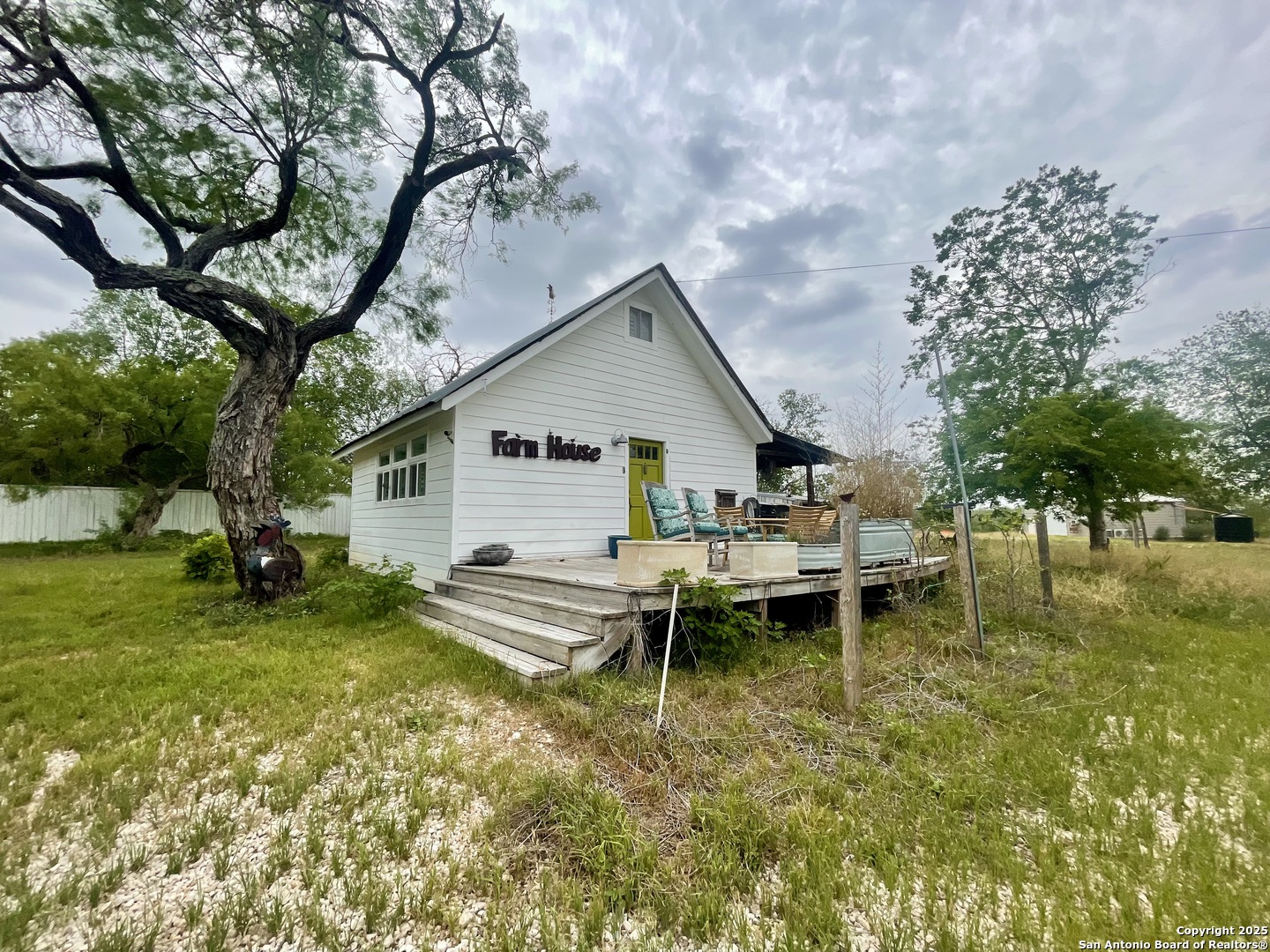 2230 Weil Road Marion, TX 78124 - Photo 1 of 21 a backyard of a house with table and chairs