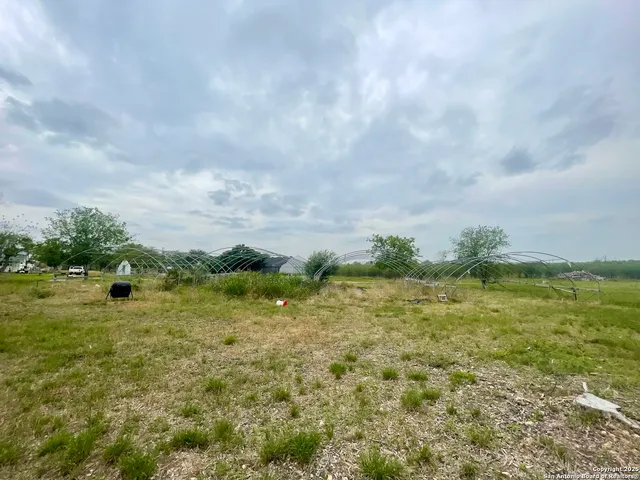 a view of a lake with a yard