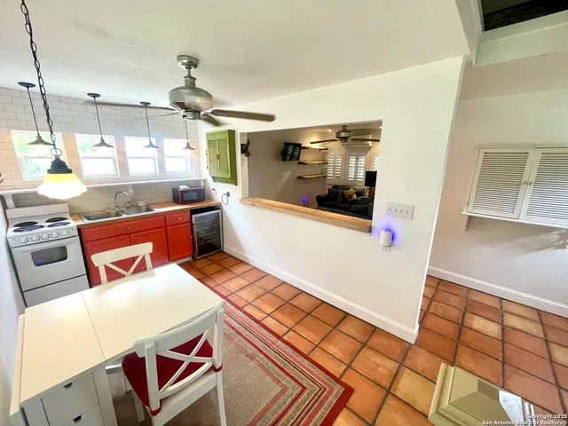 a very nice looking dining room with a large window