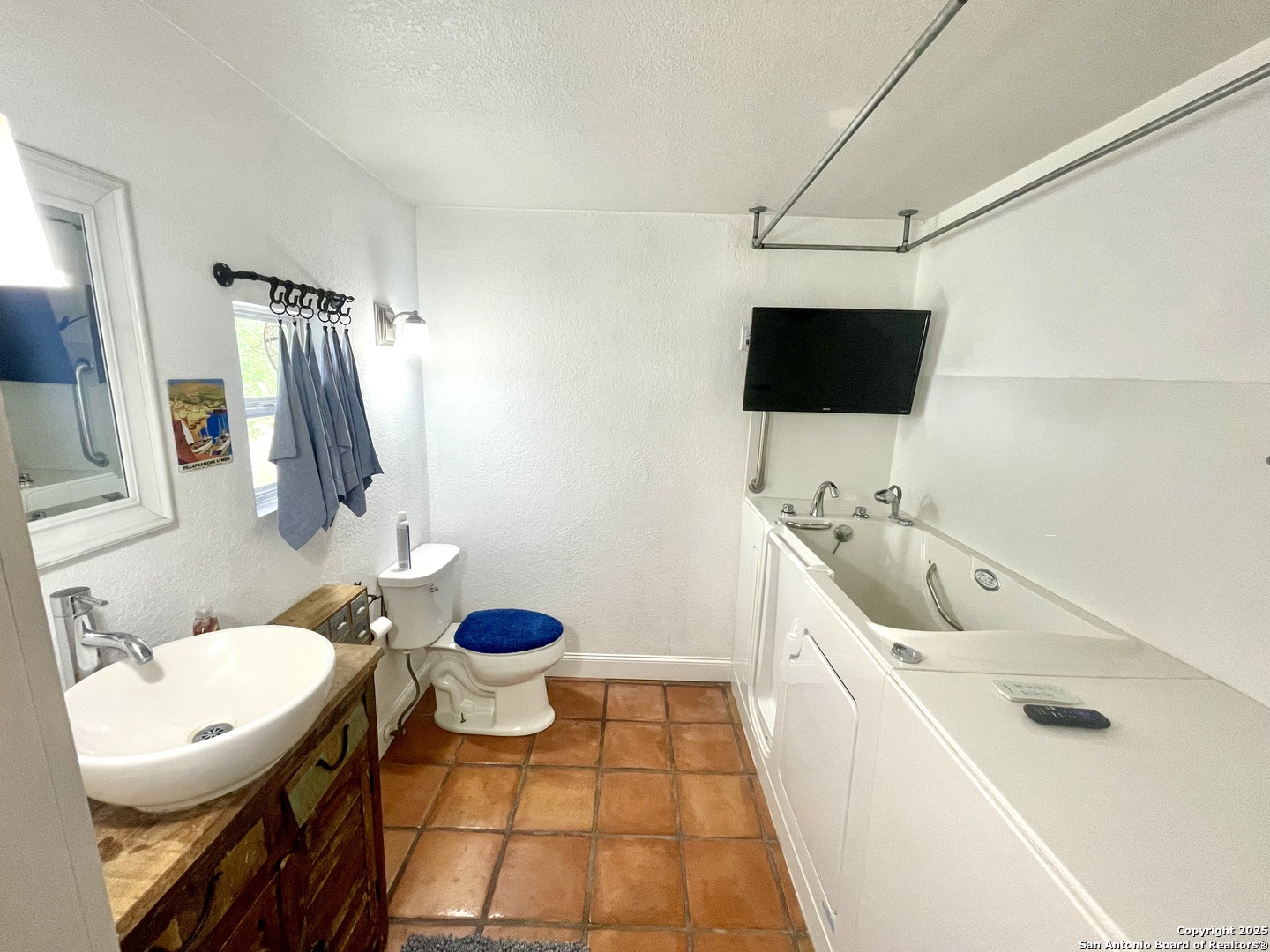 2230 Weil Road Marion, TX 78124 - Photo 5 of 21 a bathroom with a sink a toilet and a mirror
