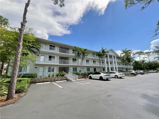 a cars parked in front of a building