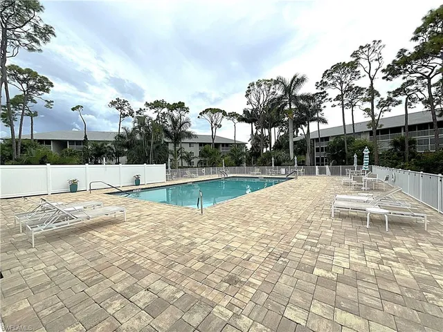 a view of a swimming pool with a patio
