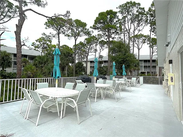 a view of a dinning table and chairs in the patio