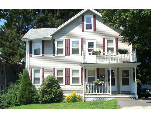 39 Bradford Road, Unit 39 Watertown, MA 02472 - Photo 1 of 1 a front view of a house with a garden