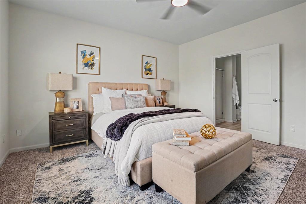 125 Sammy Venus, TX 76084 - Photo 18 of 39 Spacious bedroom featuring light neutral wall paint, carpet flooring, and a ceiling fan with integrated lighting