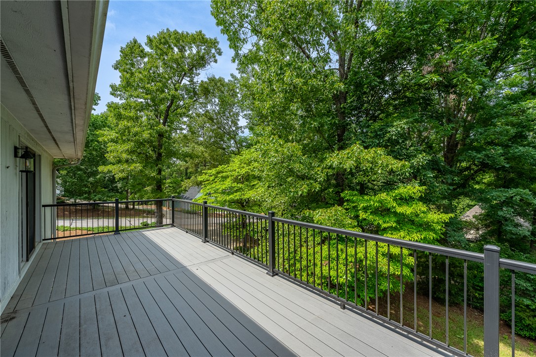118 Beacon Ridge Circle Salem, SC 29676 - Photo 31 of 45 Overlooking verdant surroundings, a spacious outdoor deck offers peaceful outdoor living.