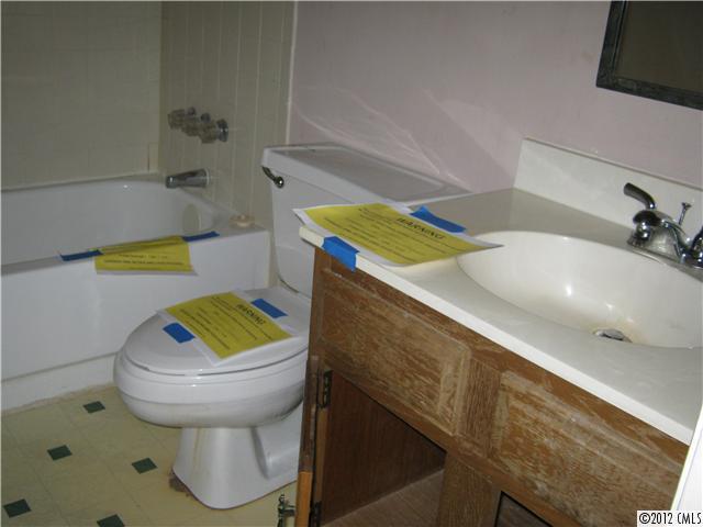 1604 Sharon Road West, Unit 29 Charlotte, NC 28210 - Photo 5 of 5 a bathroom with a sink and a toilet