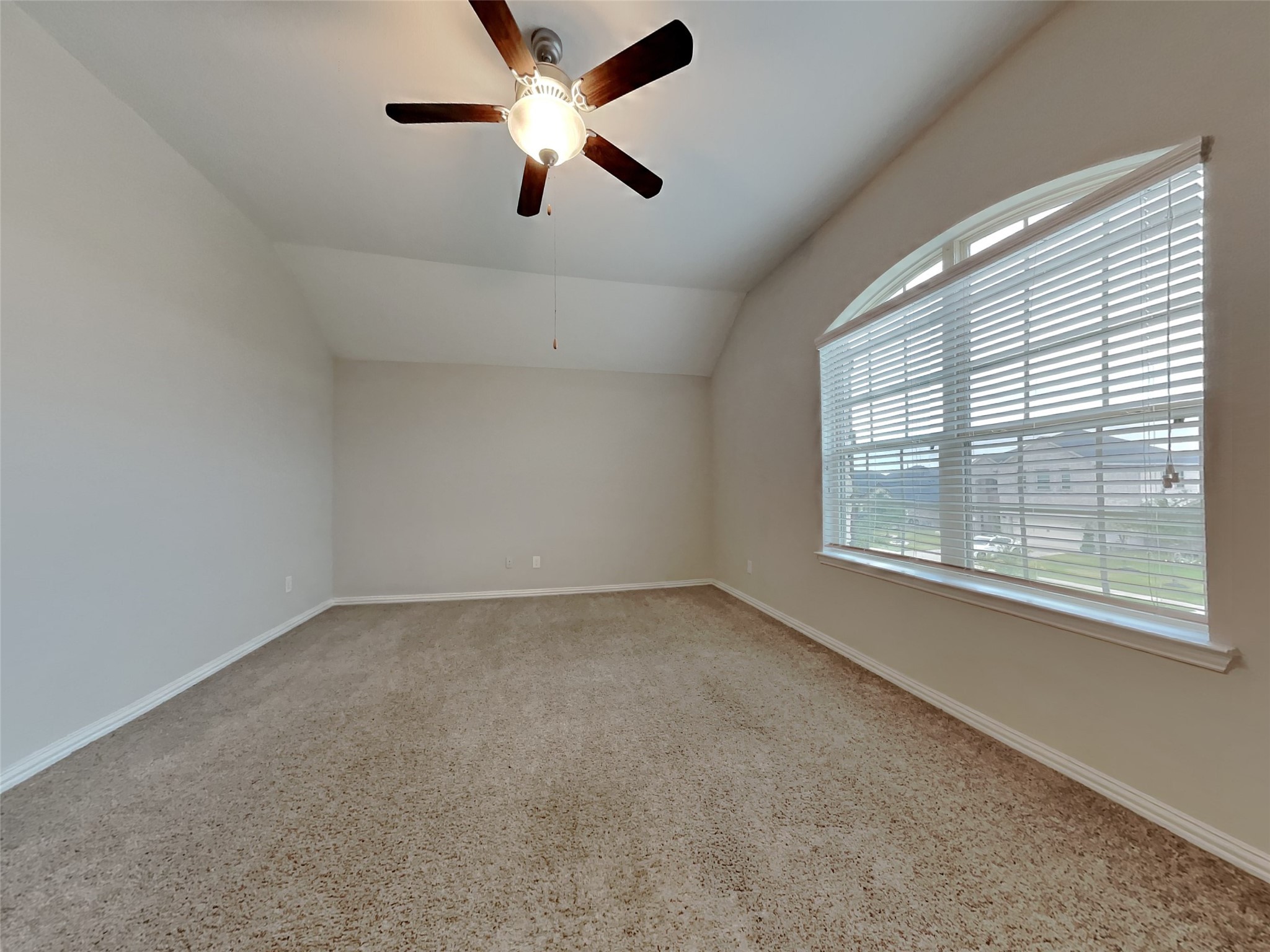 3434 Stablewood Grove Lane Spring, TX 77386 - Photo 4 of 22 an empty room with a window and a fan